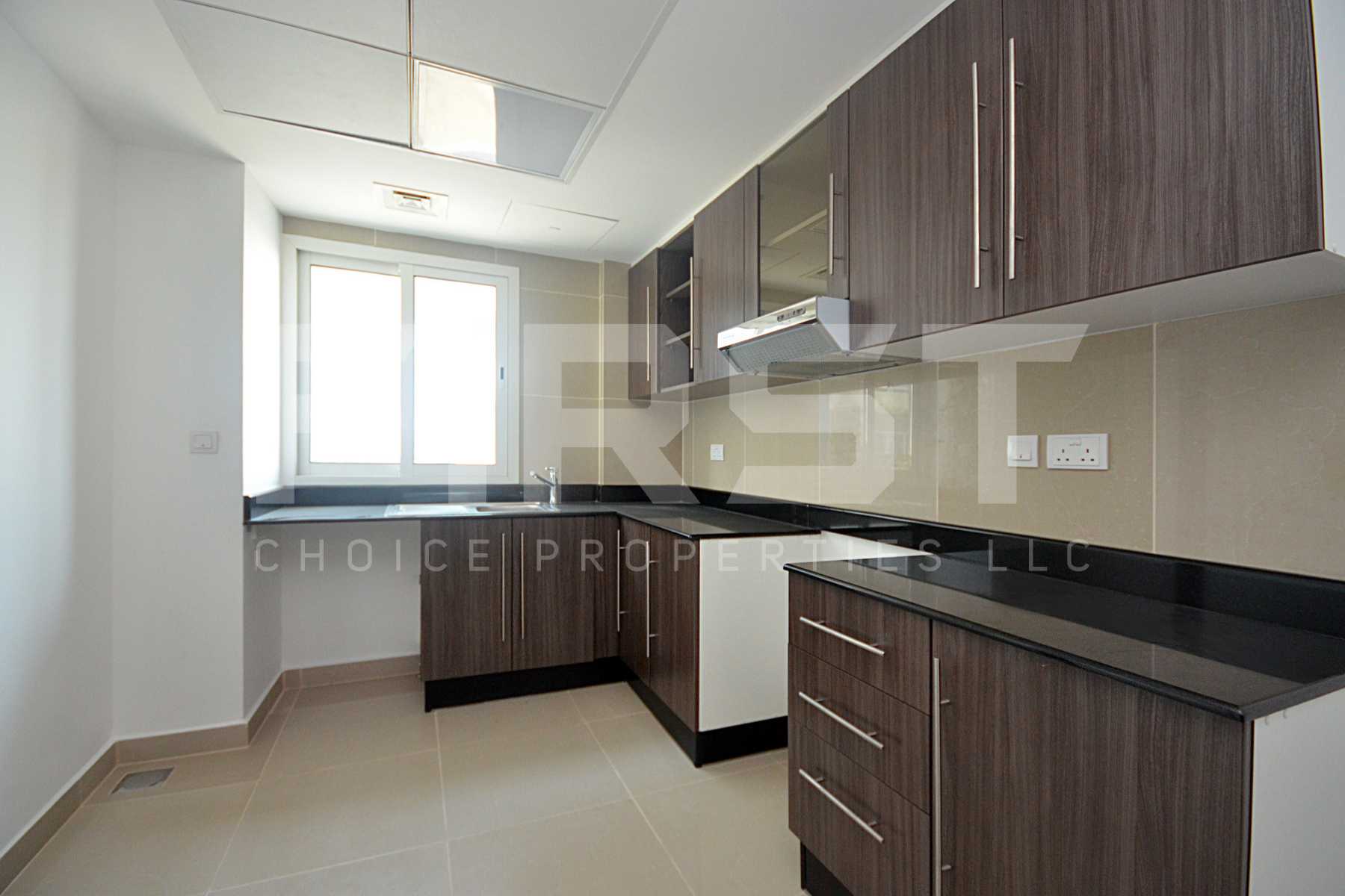 Internal Photo of 3 Bedroom Apartment Closed Kitchen in Al Reef Downtown Al Reef Abu Dhabi UAE (5).jpg
